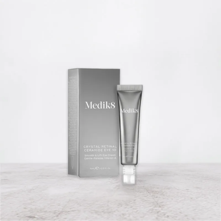 Medik8 Crystal Retinal Ceramide Eye 10 is displayed in sleek silver packaging, designed to rejuvenate and brighten the delicate eye area.