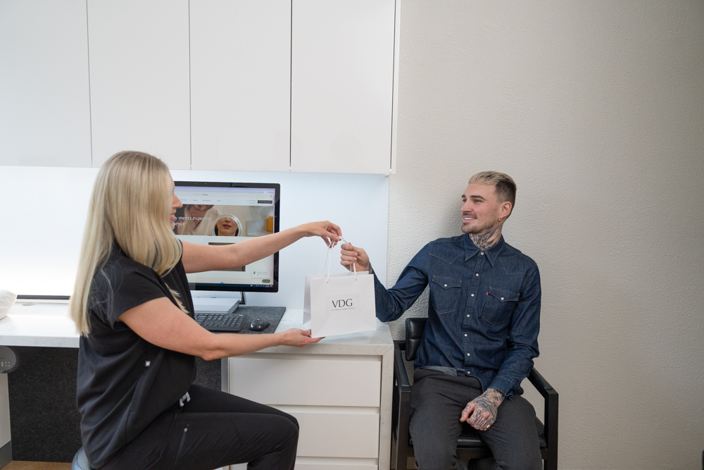 A client receiving their Dermaceutic aftercare kit after their PicoWay laser treatment. 