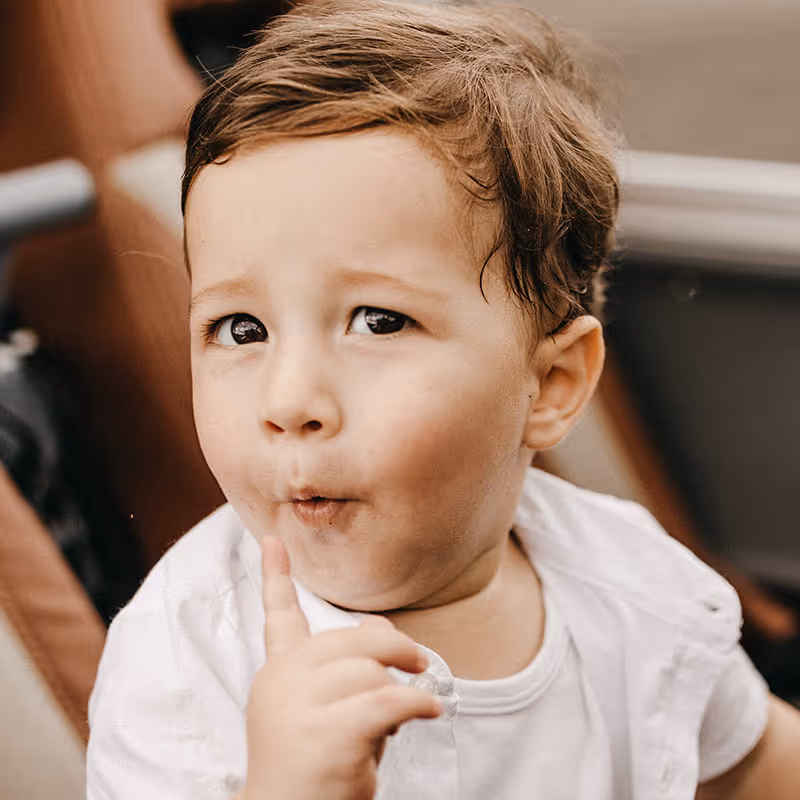 Vintage photo of child in mild surprise