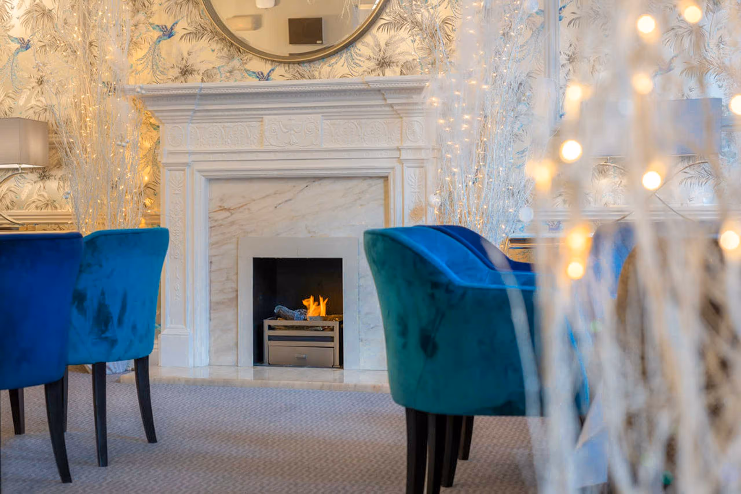 Close up of the Classic British fish and chips with home made chips and tartar sauce with mixed salad and lemon garnish.