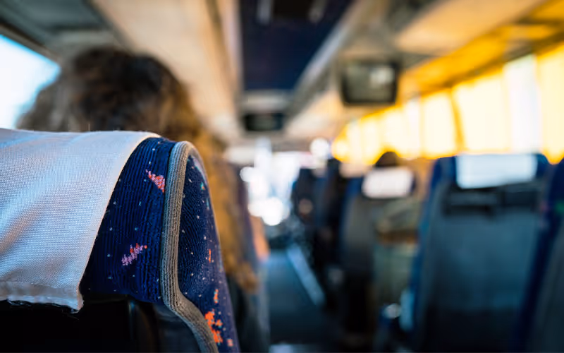 Inside of a tour coach heading to Hotel Collingwood in Bournemouth 