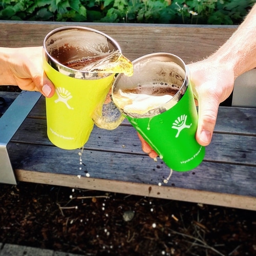 Two hydro flasks splashing together