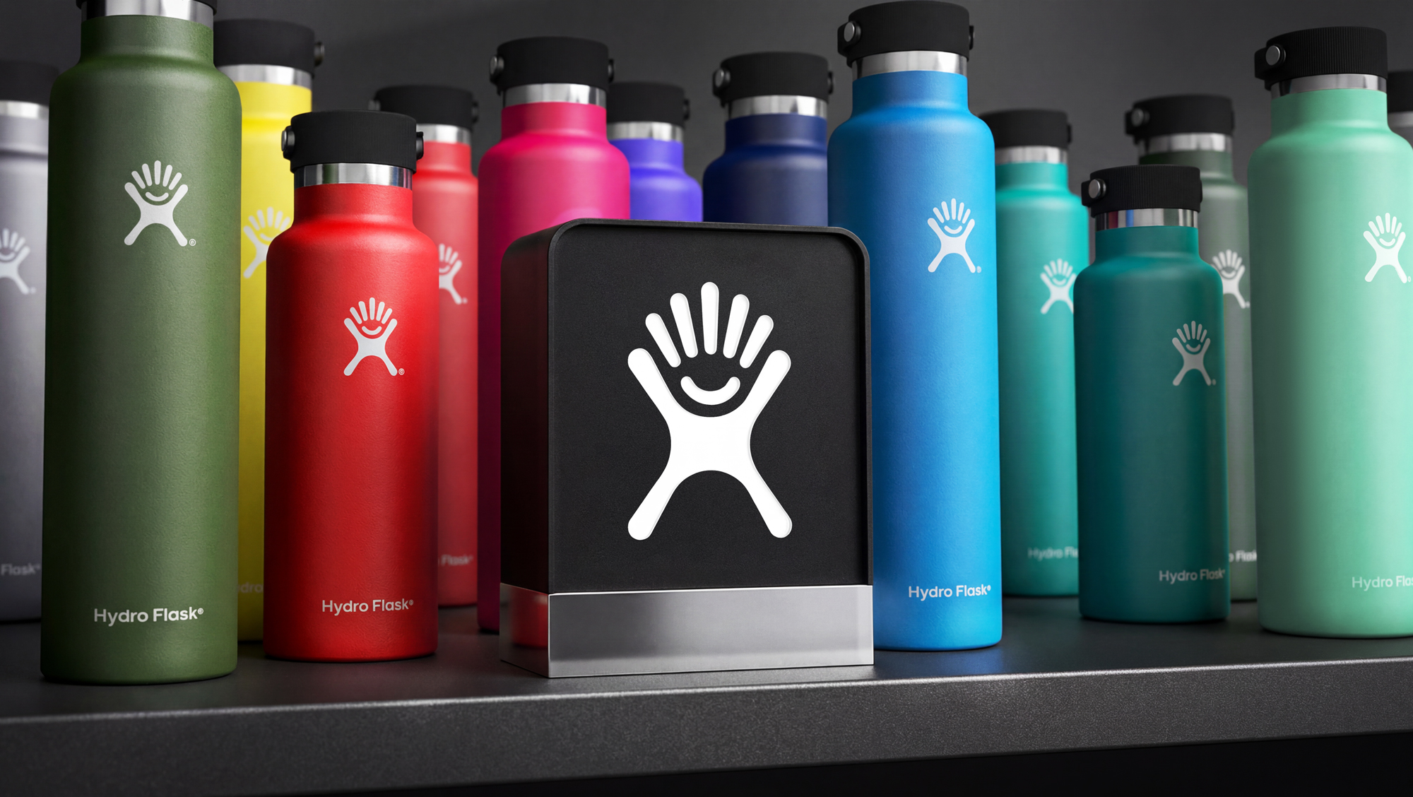 Multiple hydro flask bottles presented in different colors. 