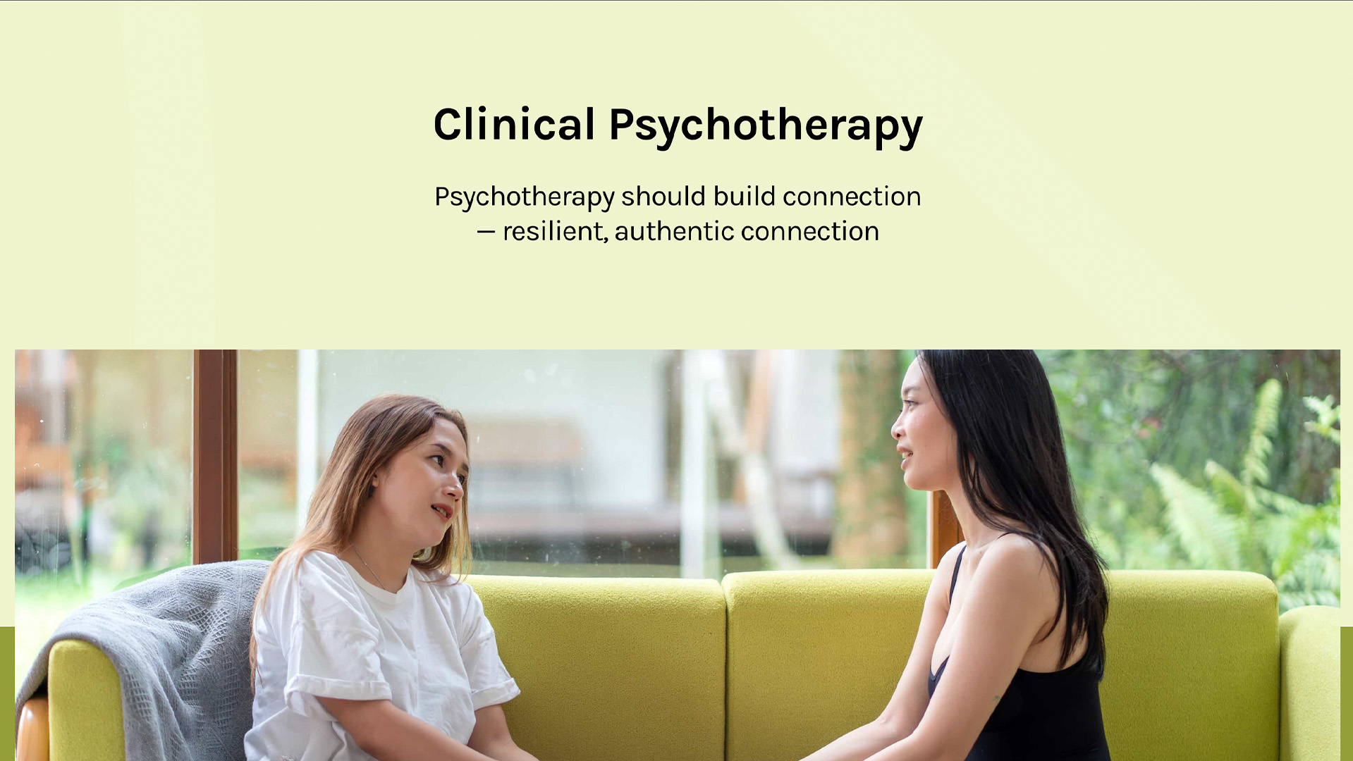 Clinical Pyschology webpage screenshot from confluencemindandmotion.com showing a woman thoughtfully listening to her friend on an olive green couch