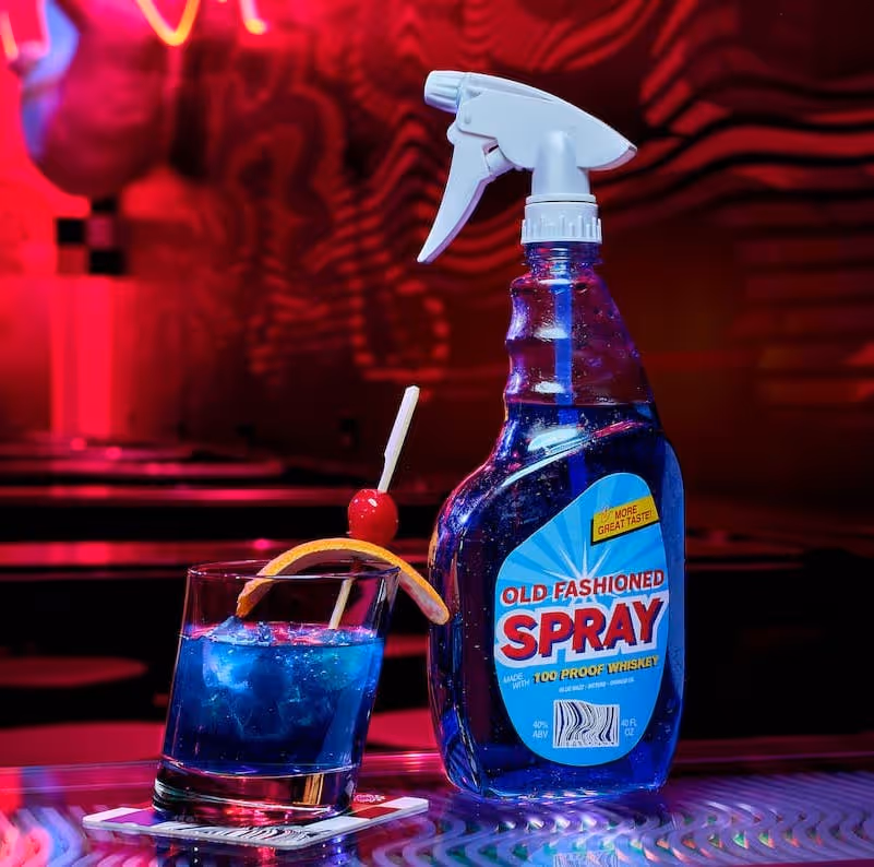 Old Fashioned spray bottle that looks like window cleaner and a blue drink at Meow Wolf's Omega Mart in Las Vegas
