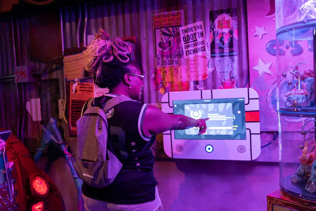 A guest looking at interactive art at Meow Wolf Denver.