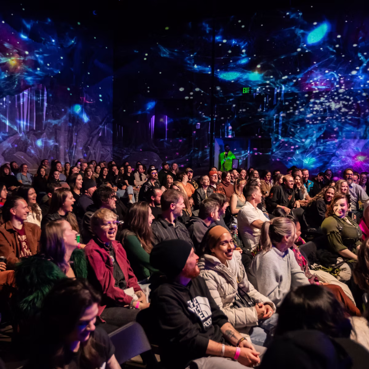 People at a corporate event at Meow Wolf Houston