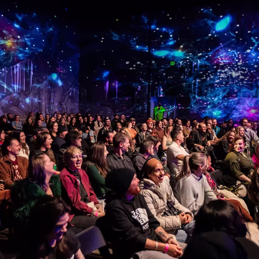 People at a corporate event at Meow Wolf Houston