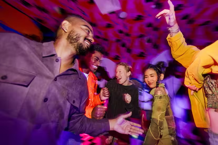 A group of visitors are enjoying themselves at Meow Wolf Radio Tave. 