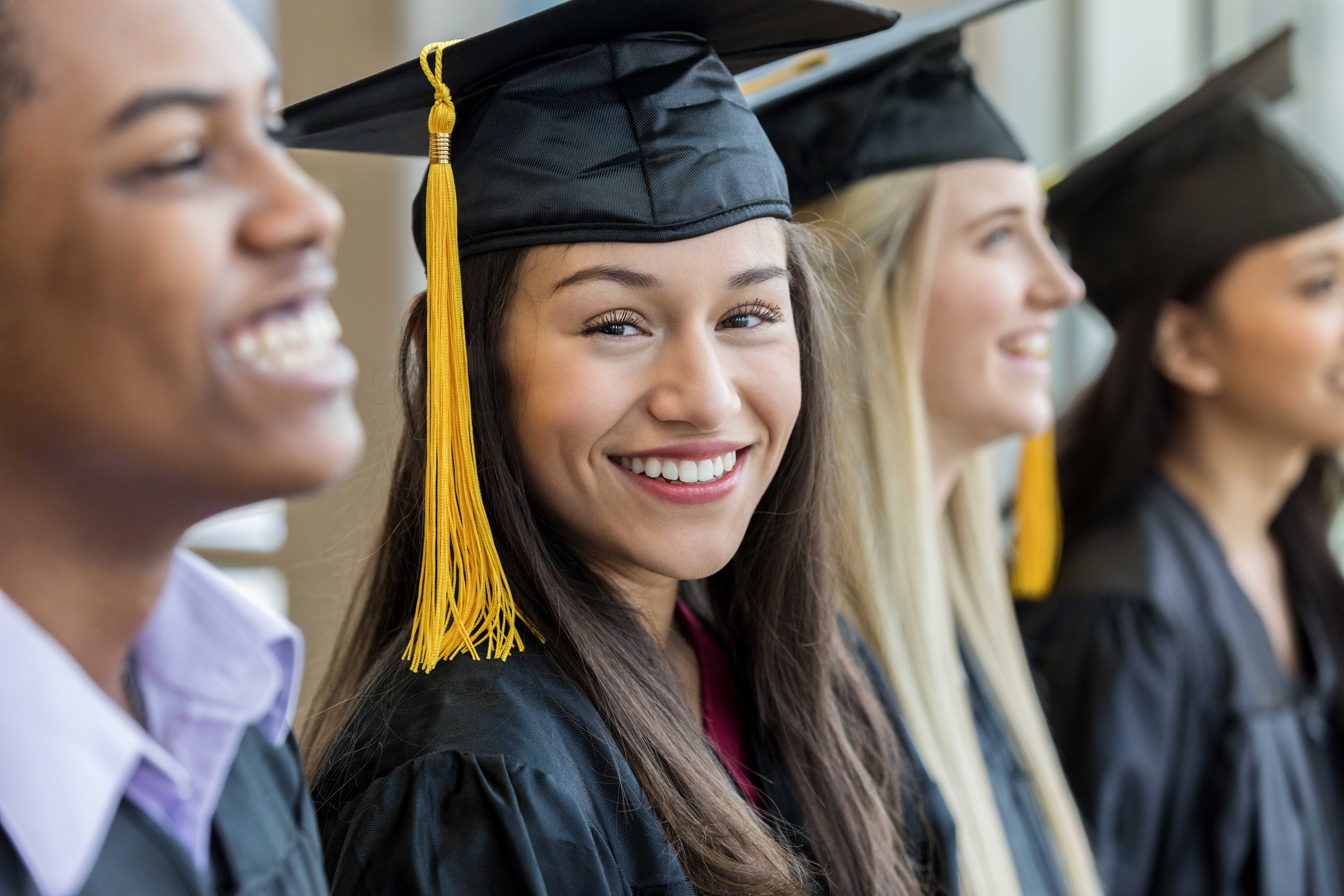 girl wearing graduation cap and gown
