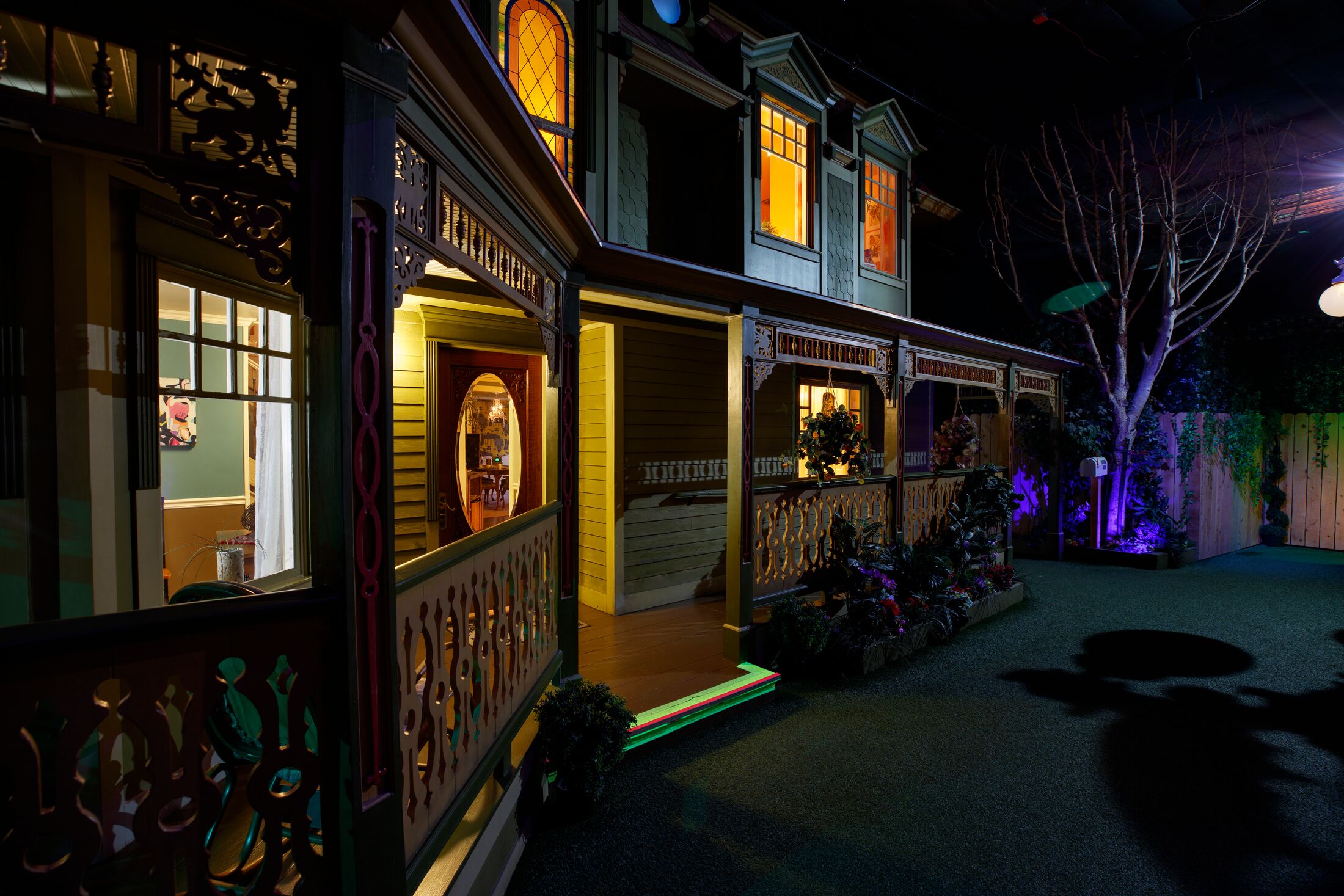House with lights on at Meow Wolf