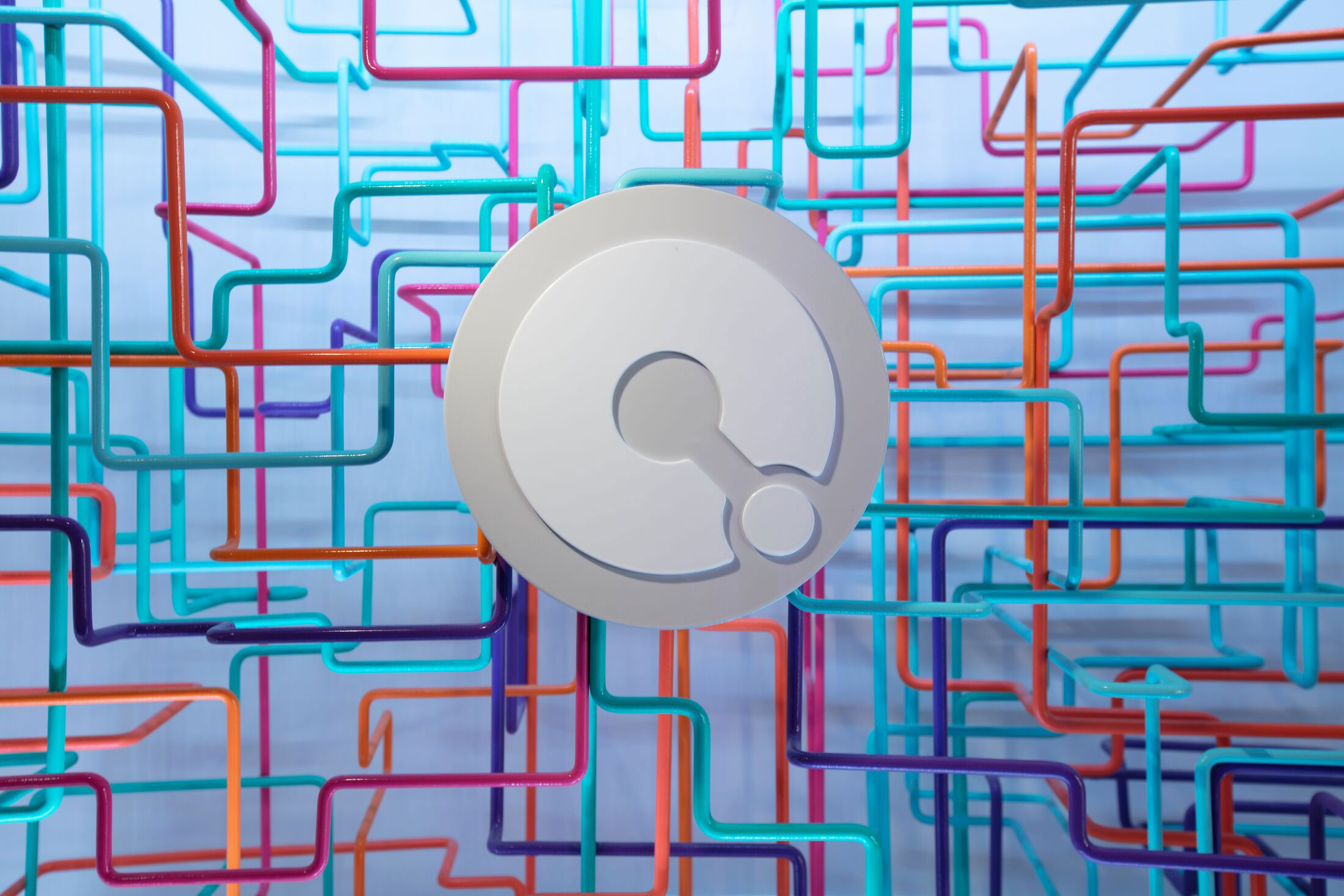 a "Q" against a background of lines