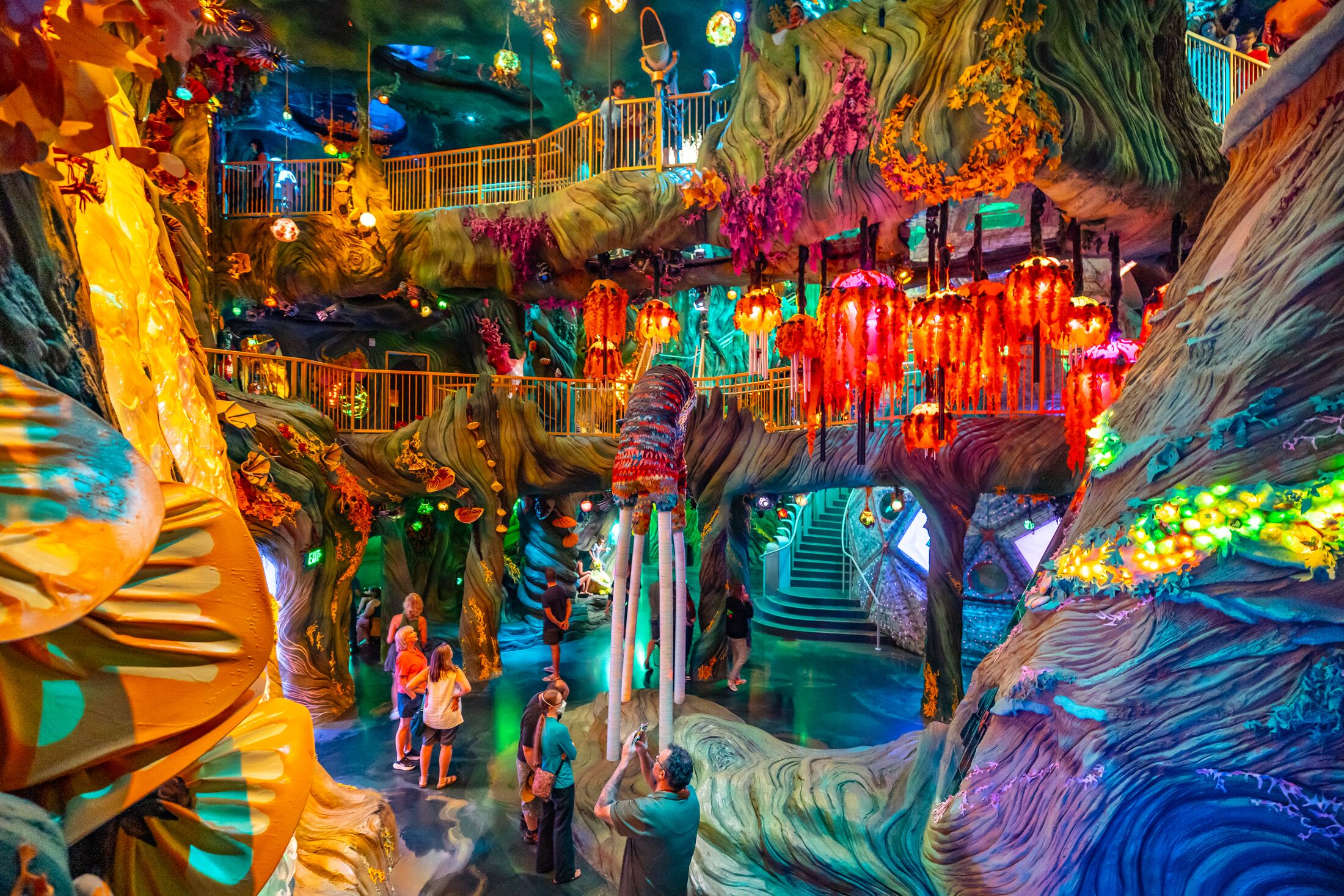 a sentient sixth dimensional forest with creatures who are learning from visitors of Meow Wolf