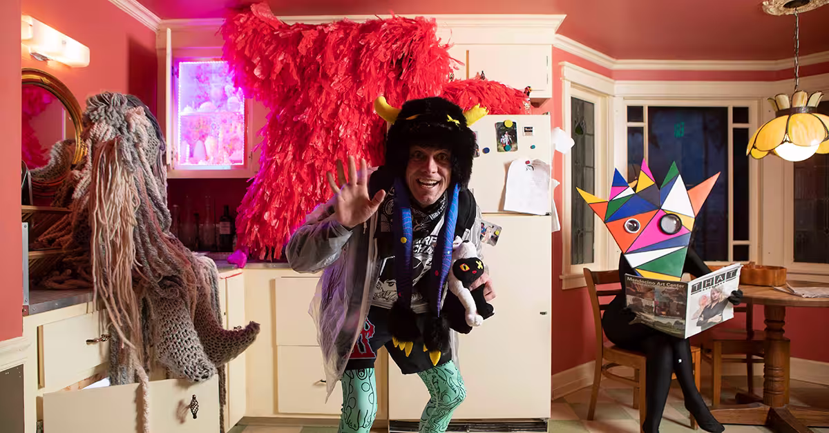 Four Meow Wolf creatures pose in the House of Eternal Return’s Selig kitchen