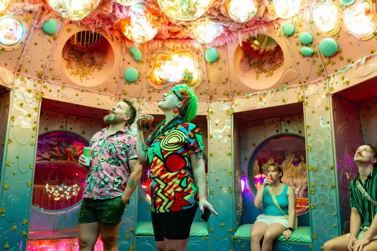 people hanging out at a 21+ night at Meow Wolf