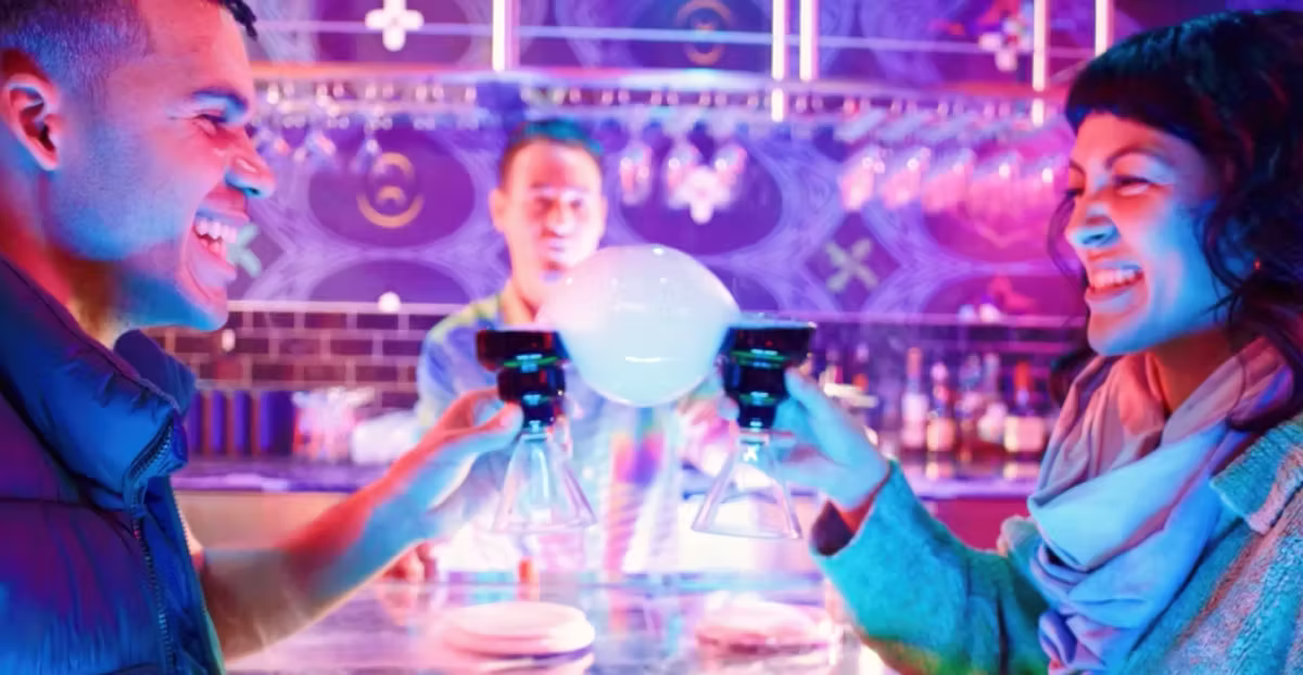 long bar space with neon lights called Datamosh inside Omega Mart