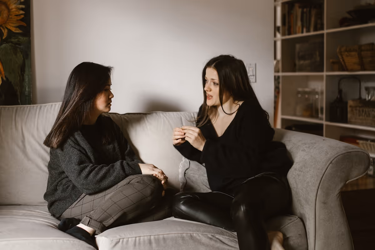 Two women having a deep conversation.