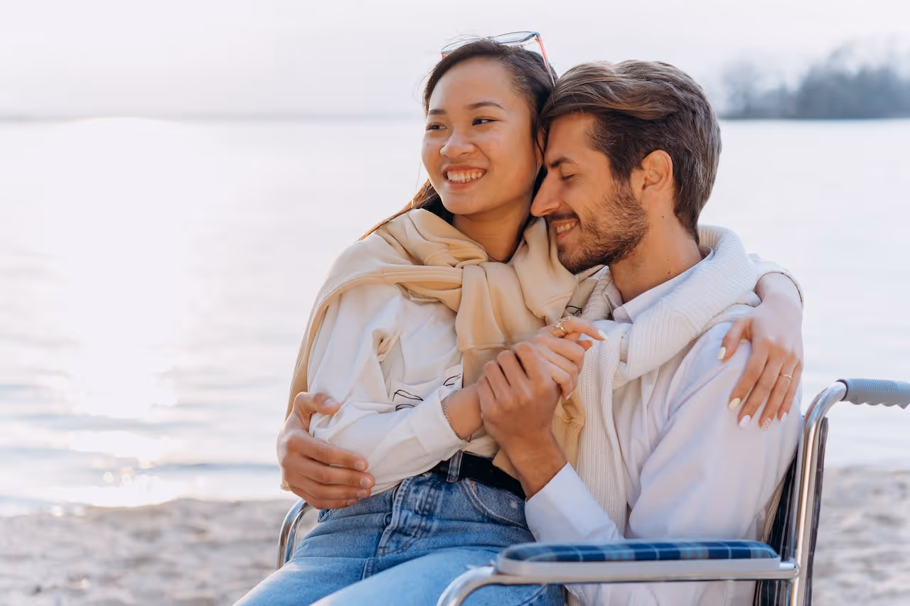 friends who started dating sitting together by the water