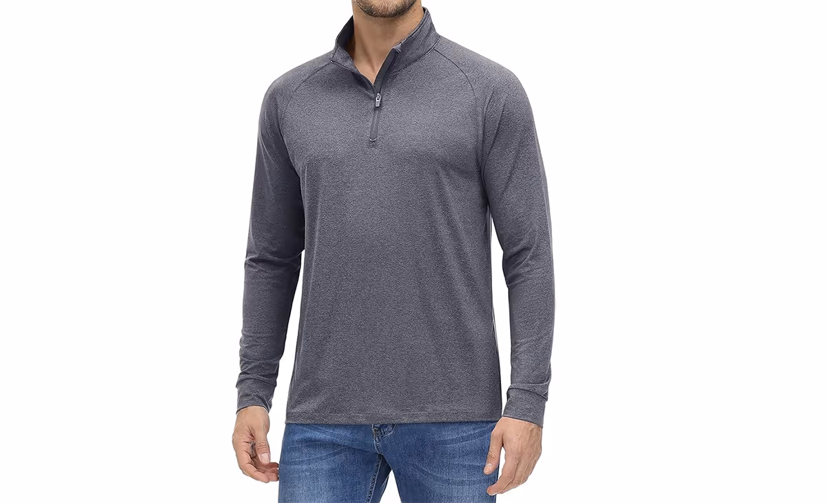 A man wearing a gray, long sleeve shirt. 