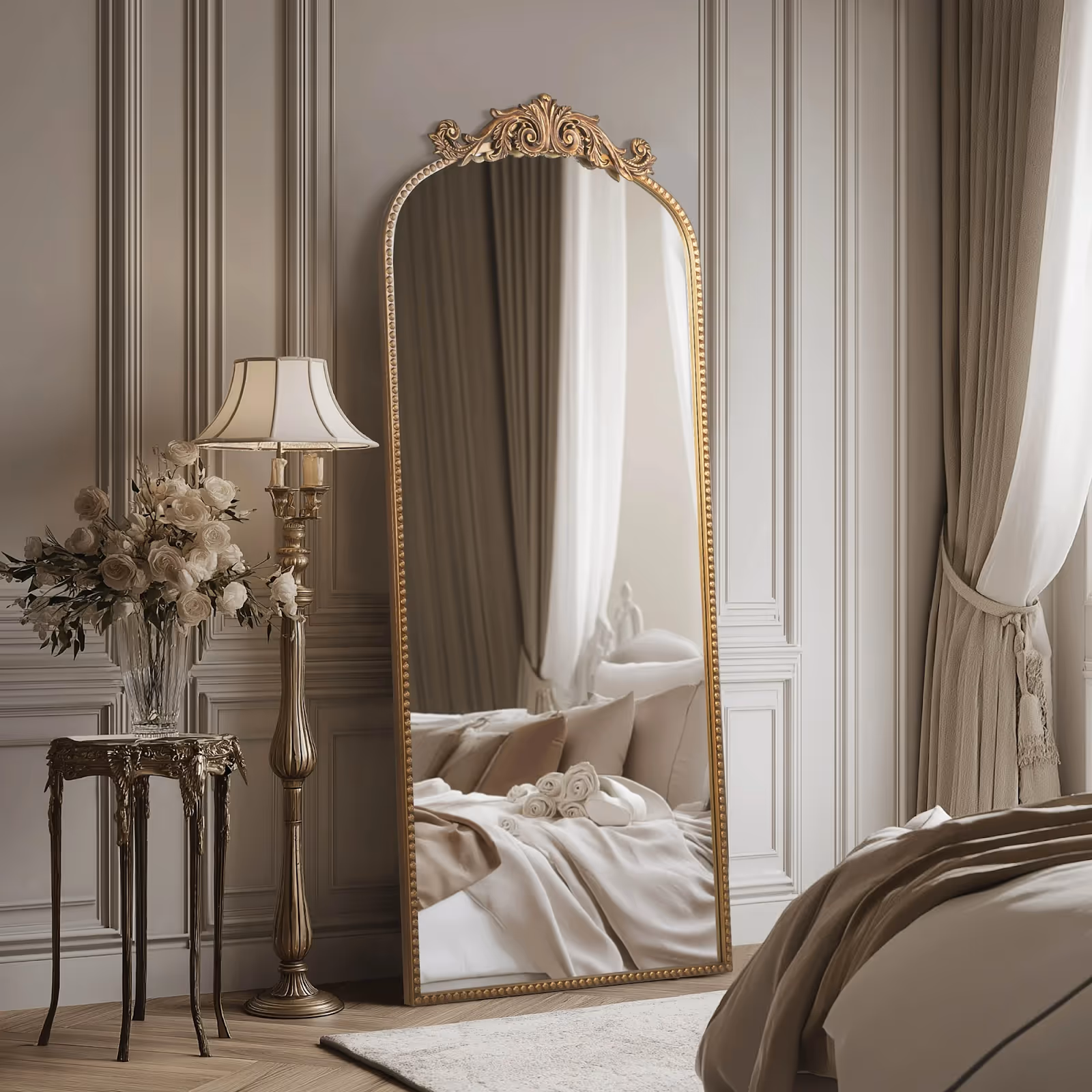 A long, gold mirror leaning on a wall