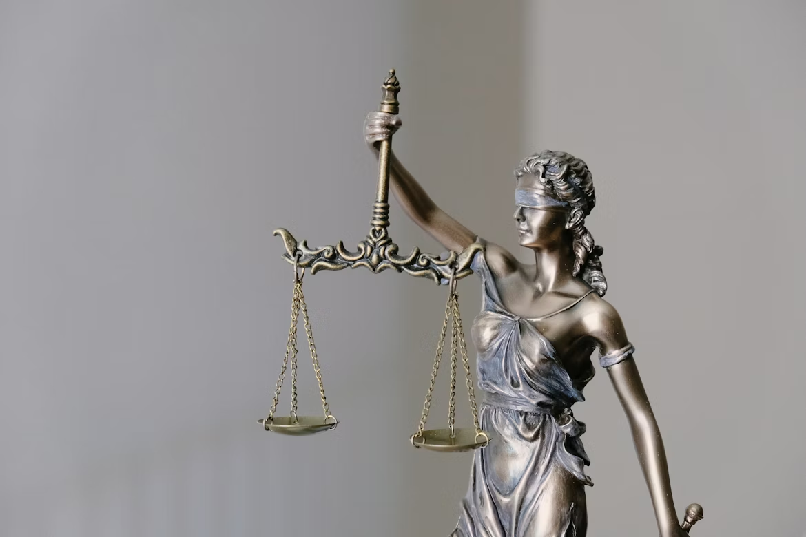 Lady Justice holding a scale and a sword.