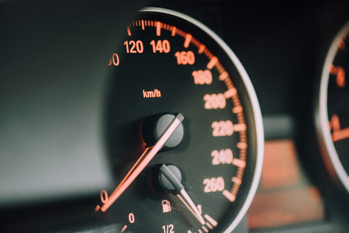 A close-up of a car’s speedometer. The indicator is at 0.