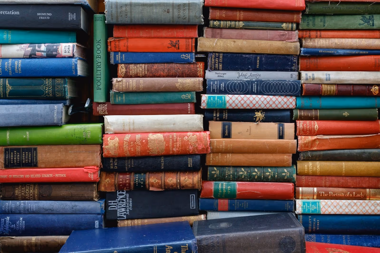 stacks of vintage books every guy should read in his 20s