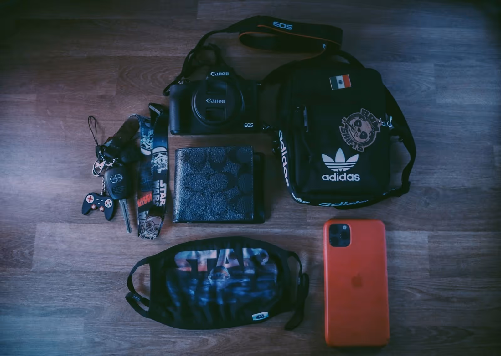 everyday carry including keys, wallet, camera, bag, and phone