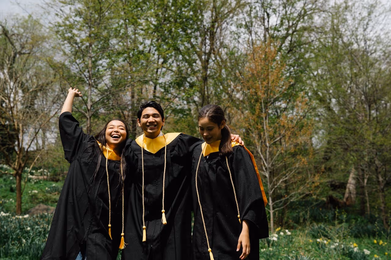 students in their graduation regalia celebrating the start of their careers and first steps into adulthood