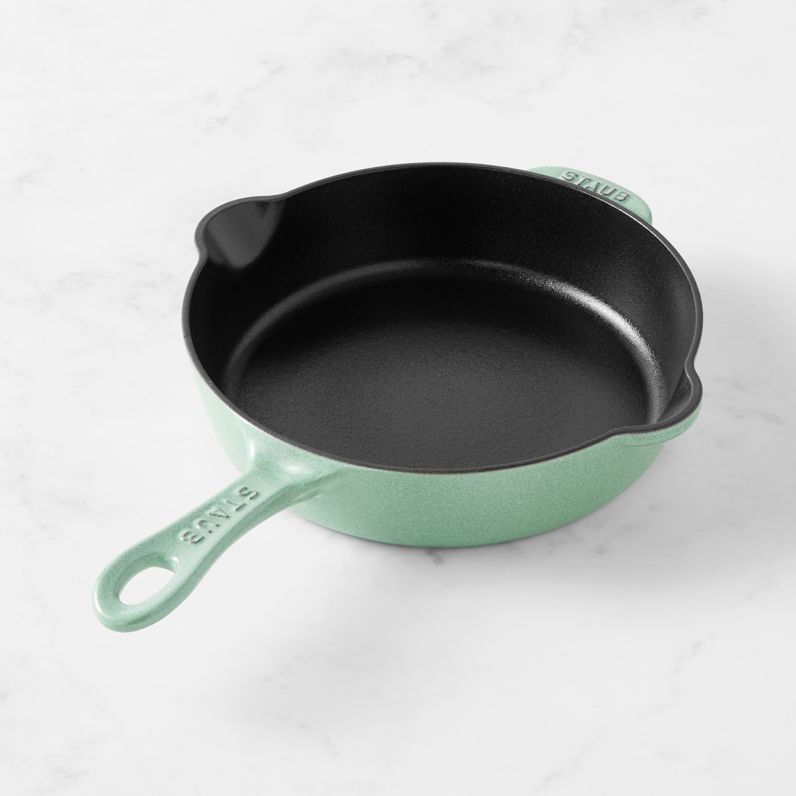 Staub enameled cast iron pan in a trendy mint color