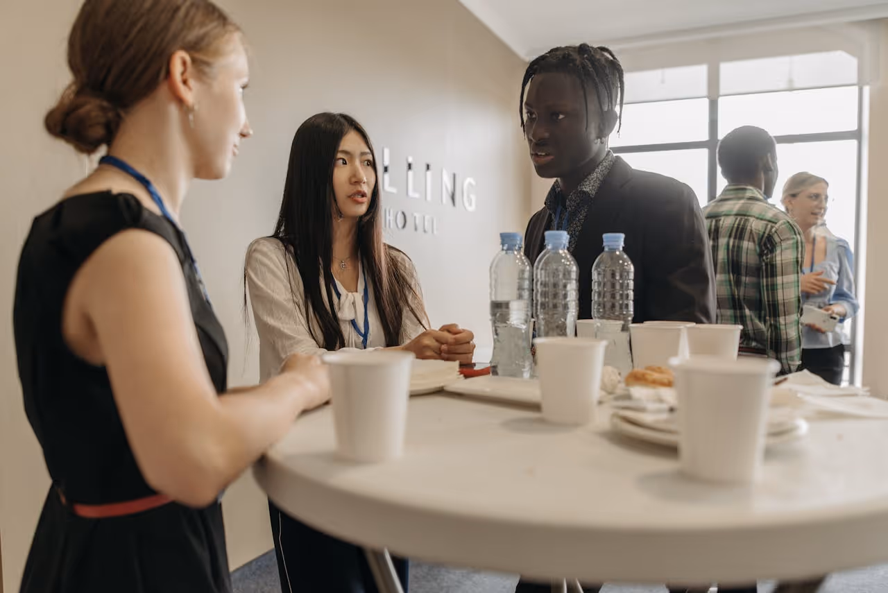 group of professionals gathered around a table at a networking event