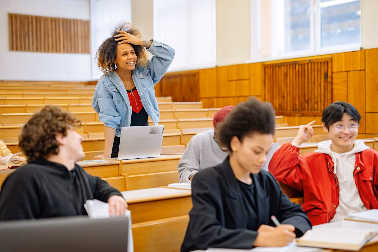 30something college student standing up to answer a question in class