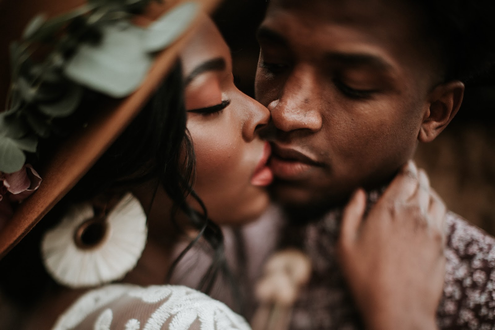 Man and woman with their faces close together