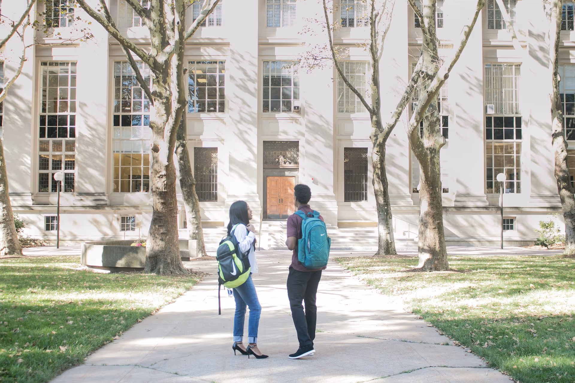 introverted student going out of her way to make friends in college by chatting with a classmate on the way to class