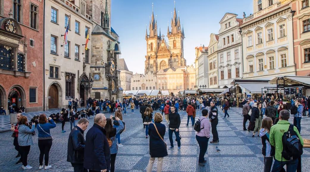 locals and travelers -- experienced, and those traveling solo for the first time -- checking out a popular tourist destination