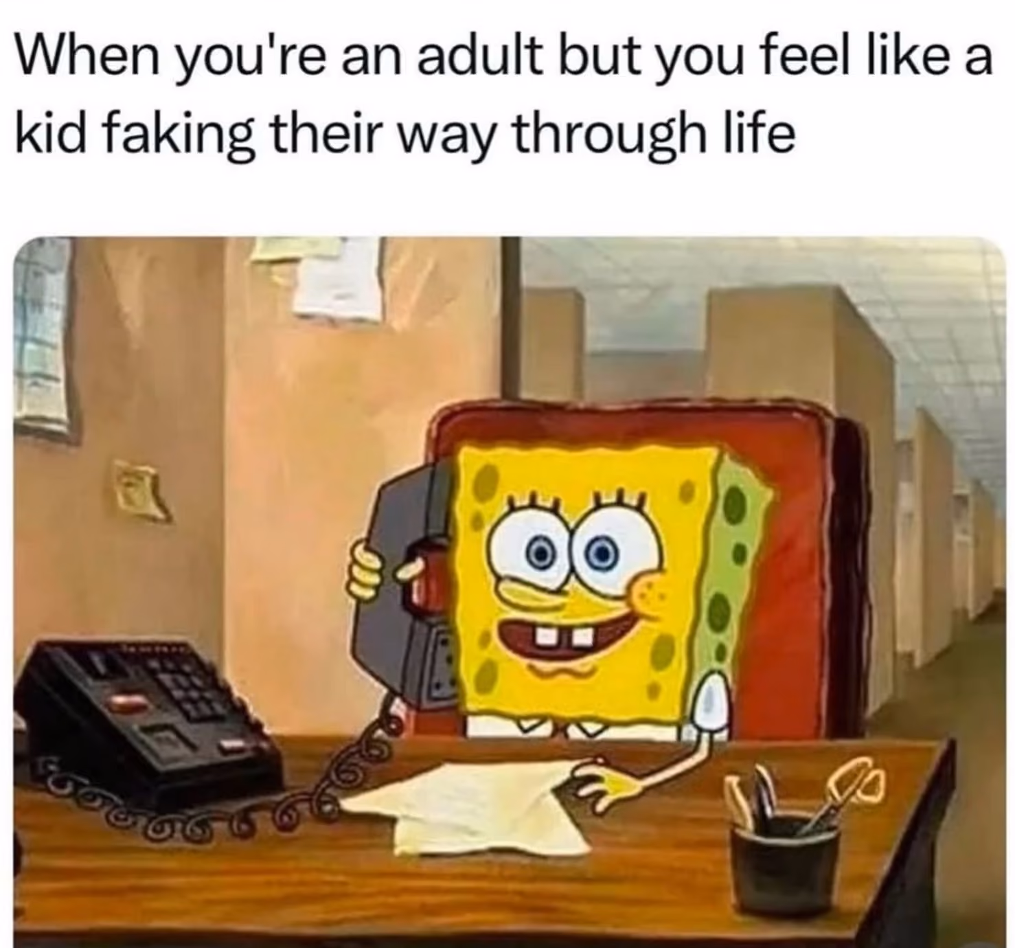 meme of Sponge Bob sitting in an office answering a phone that says when you're an adult but you feel like a kid faking their way through life