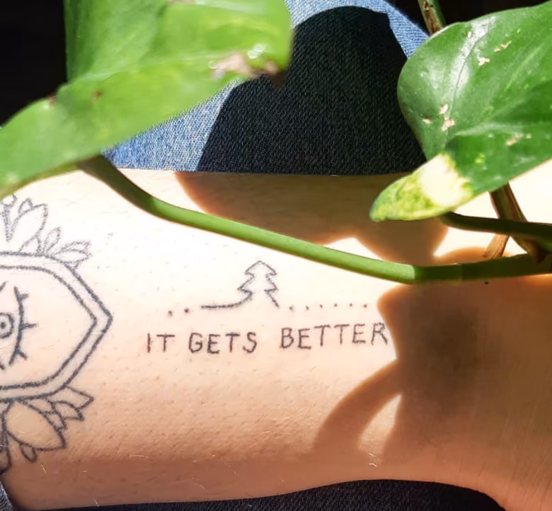 sketchy line it gets better tattoo on someone's forearm