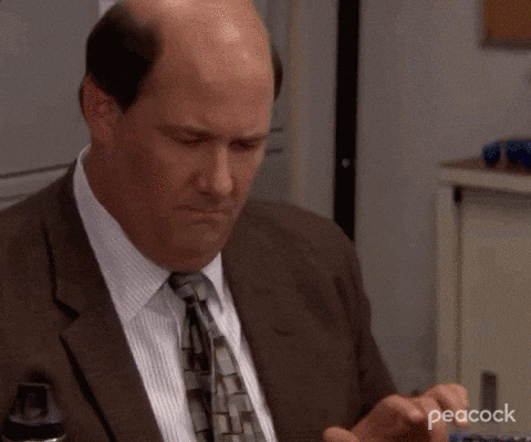 Kevin from the office doing financial calculations