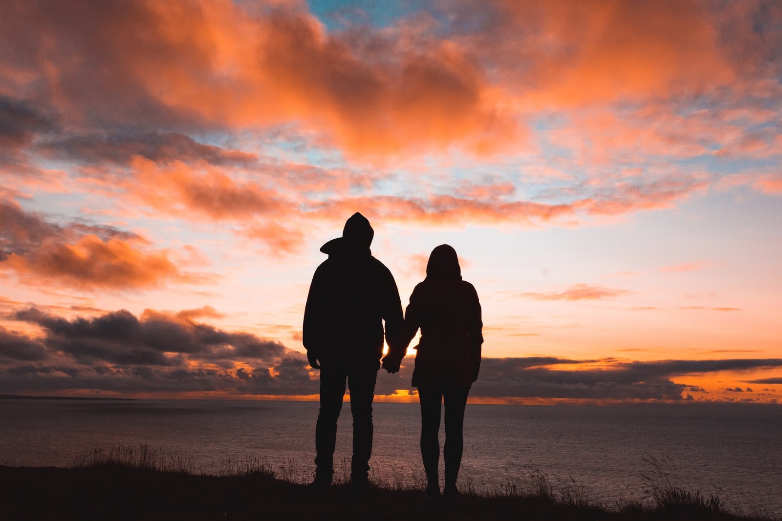 A couple holding hands.
