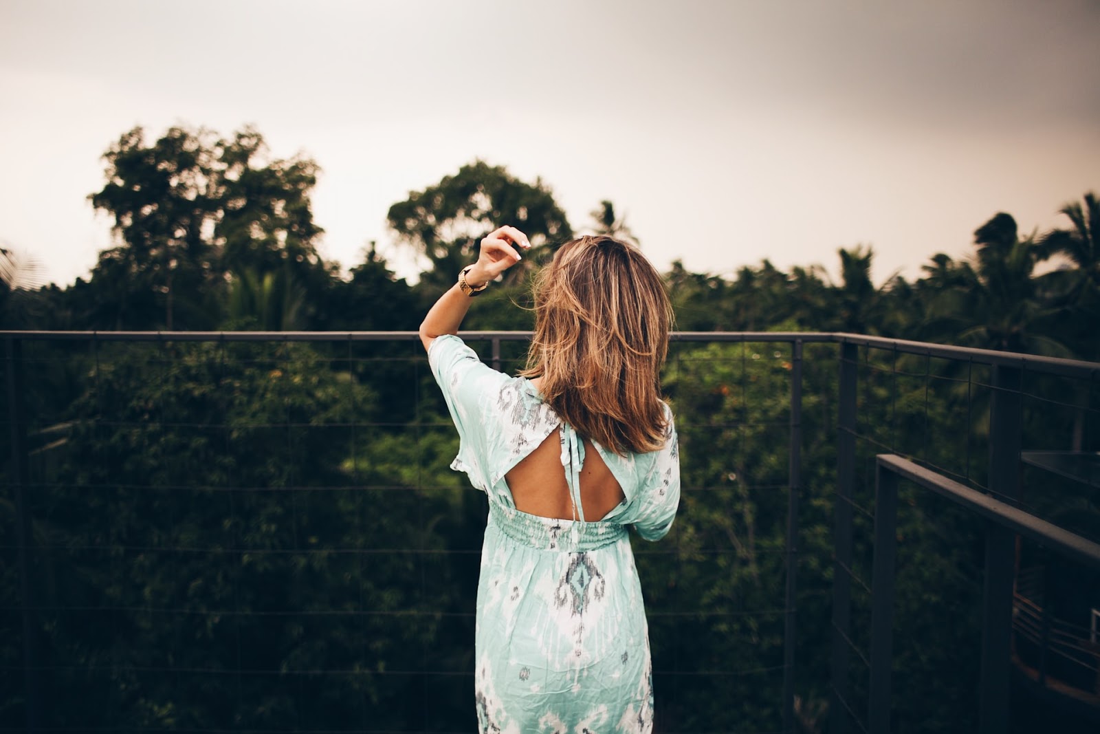 A woman on a balcony.