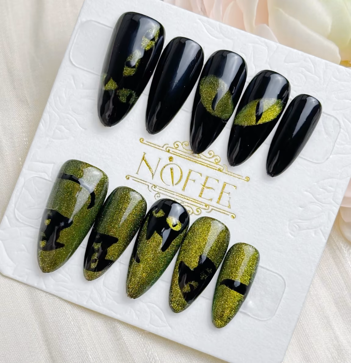 green and black cat eye nails inspired by black cats perfect for Halloween