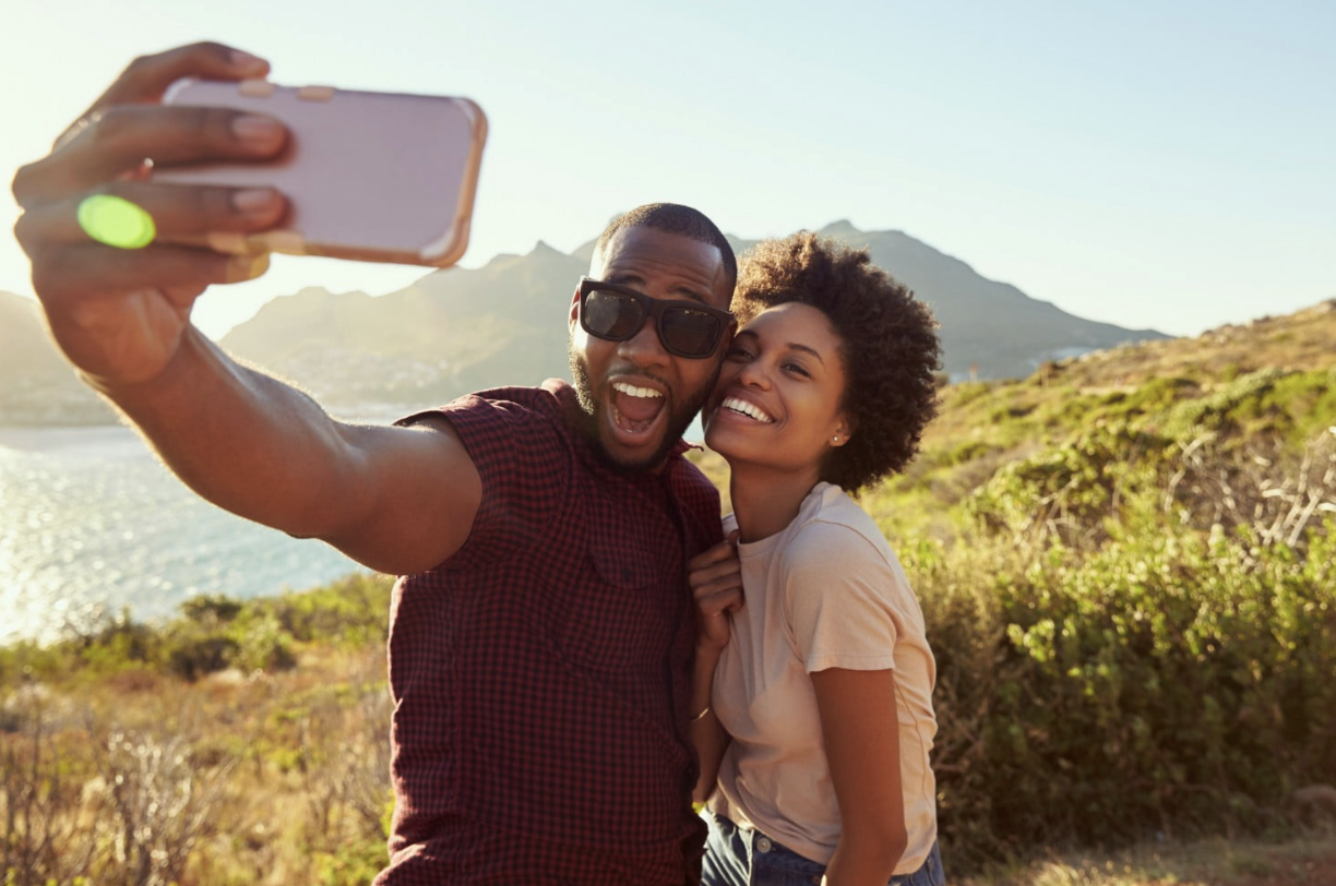 a gen z couple taking a vacation selfie