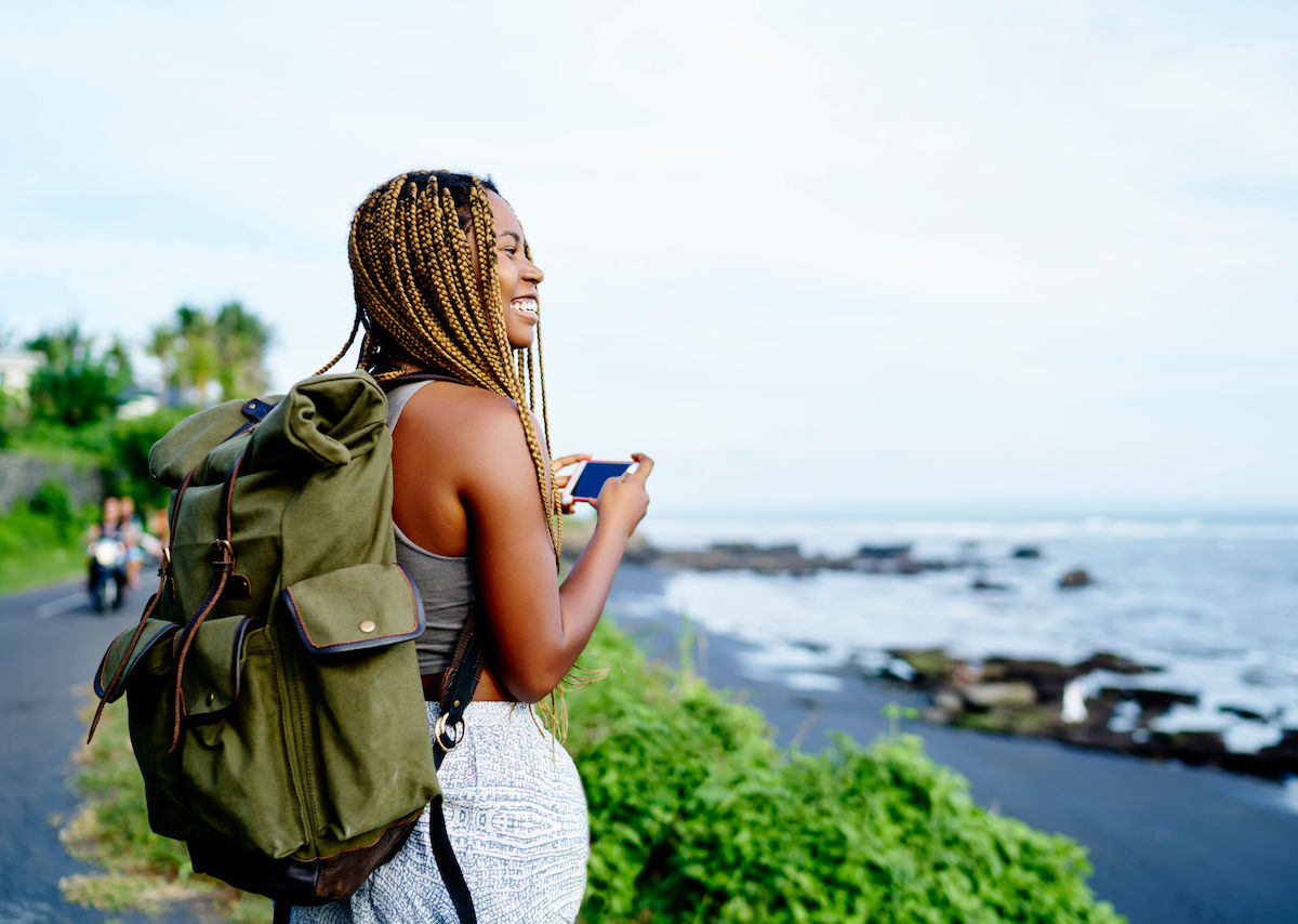 woman taking photos on a solo trip