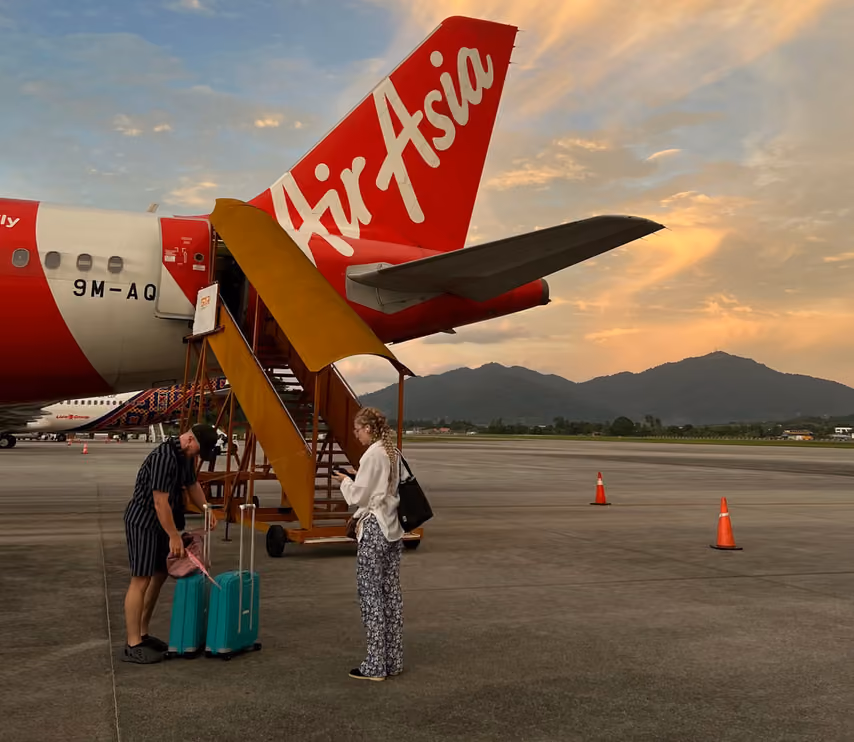 woman checking her bags as she boards a plane for her first international travel experience
