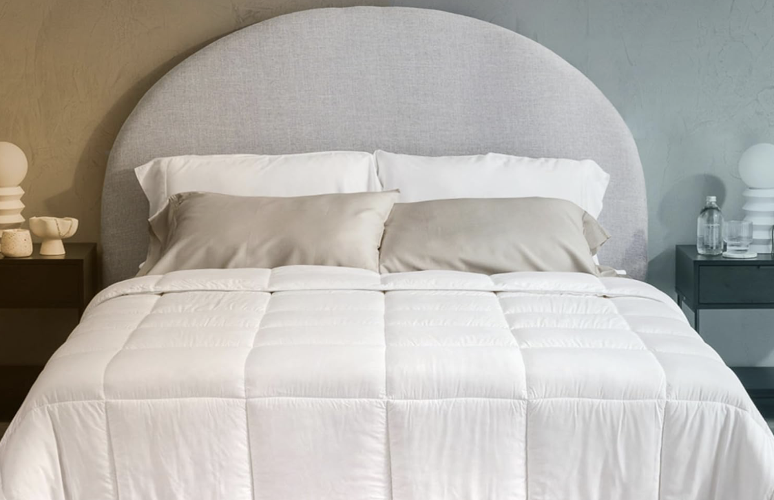 Olive + Crate Bamboo Comforter spread over a bed for a soft, luxurious look that's cooling in summer and cozy in winter