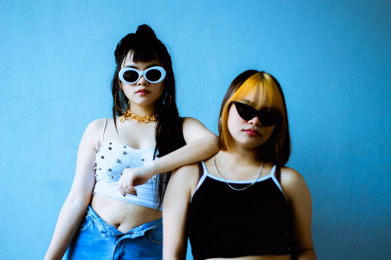 two friends wearing bold aesthetic fashion choices which will no-doubt go out of style with the next step of the microfashion cycle