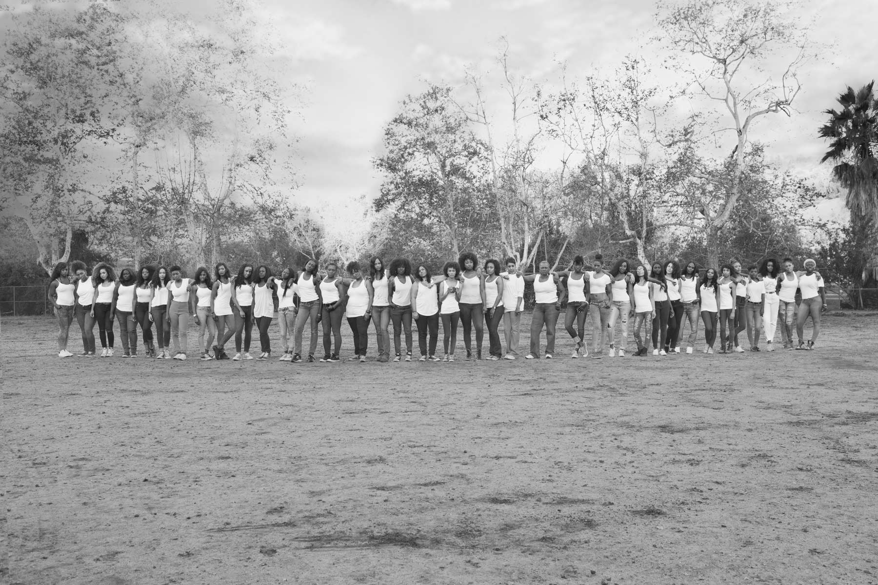 Group photo of 40 Black women celebrating body positivity and sisterhood in a park