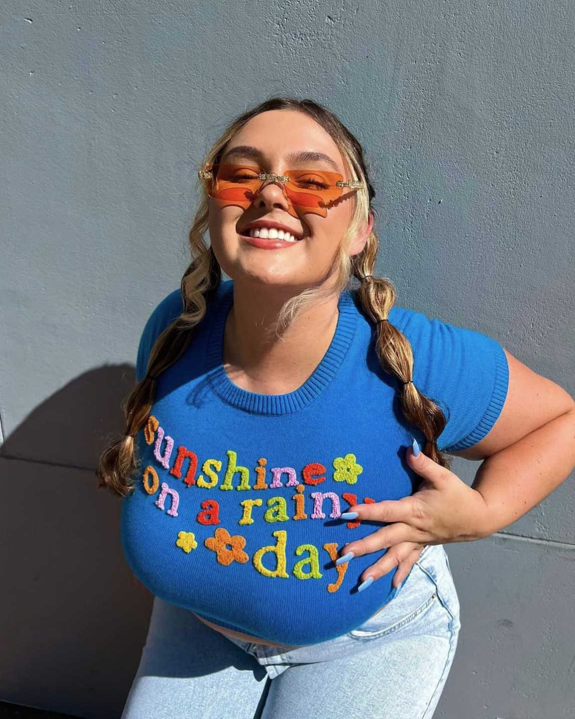 Courtney Faith standing confidently in Orlando, radiating self-love and natural beauty