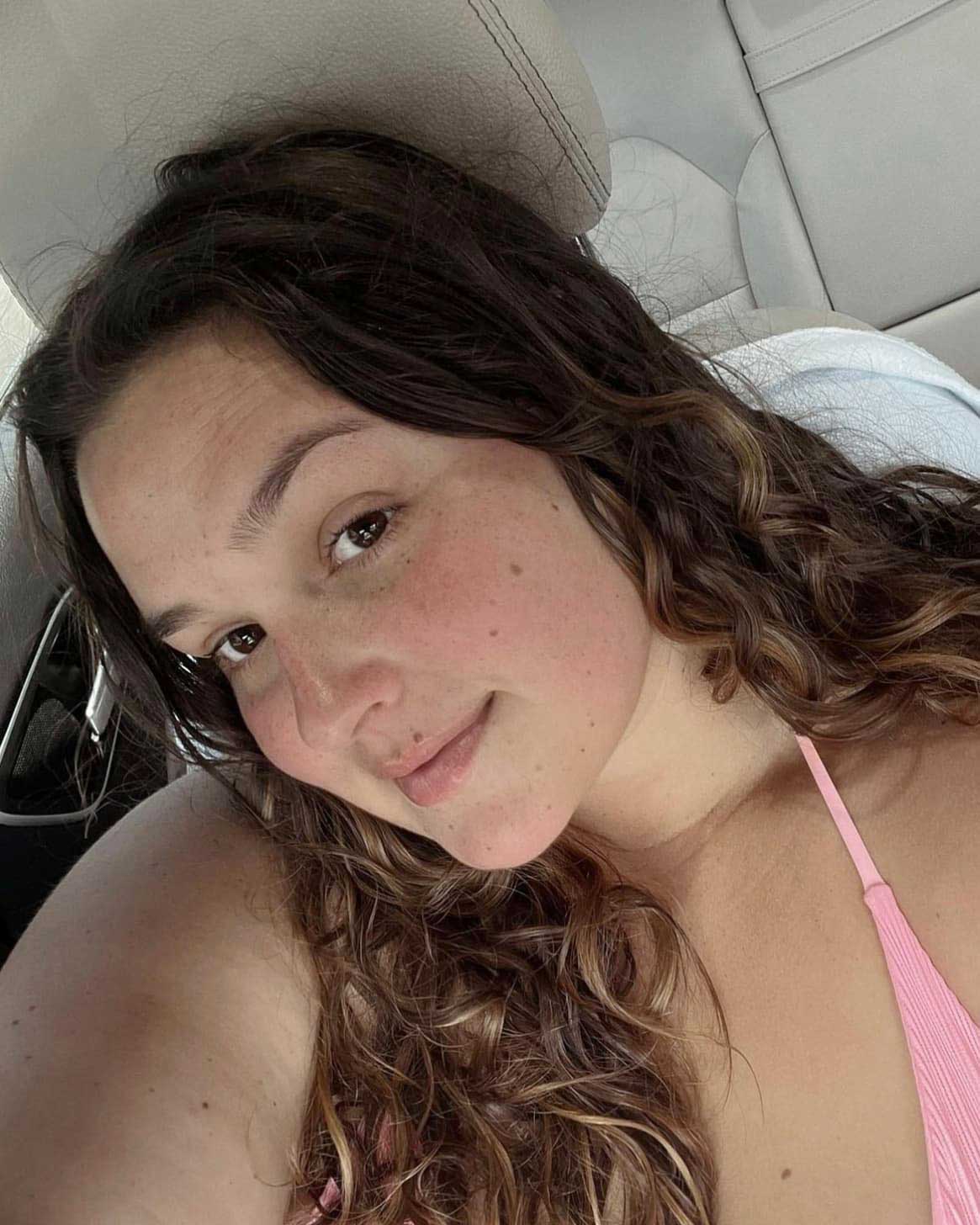 Close-up portrait of Courtney Faith with a bare face, embracing authenticity and confidence