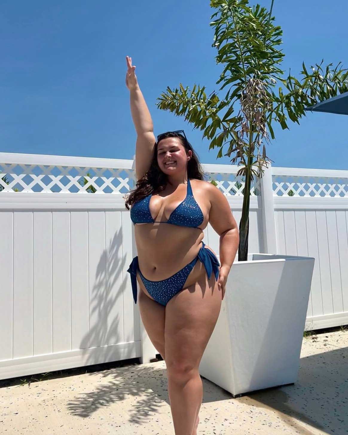 Courtney Faith at the beach during a workout, showcasing strength and her self-love transformation journey